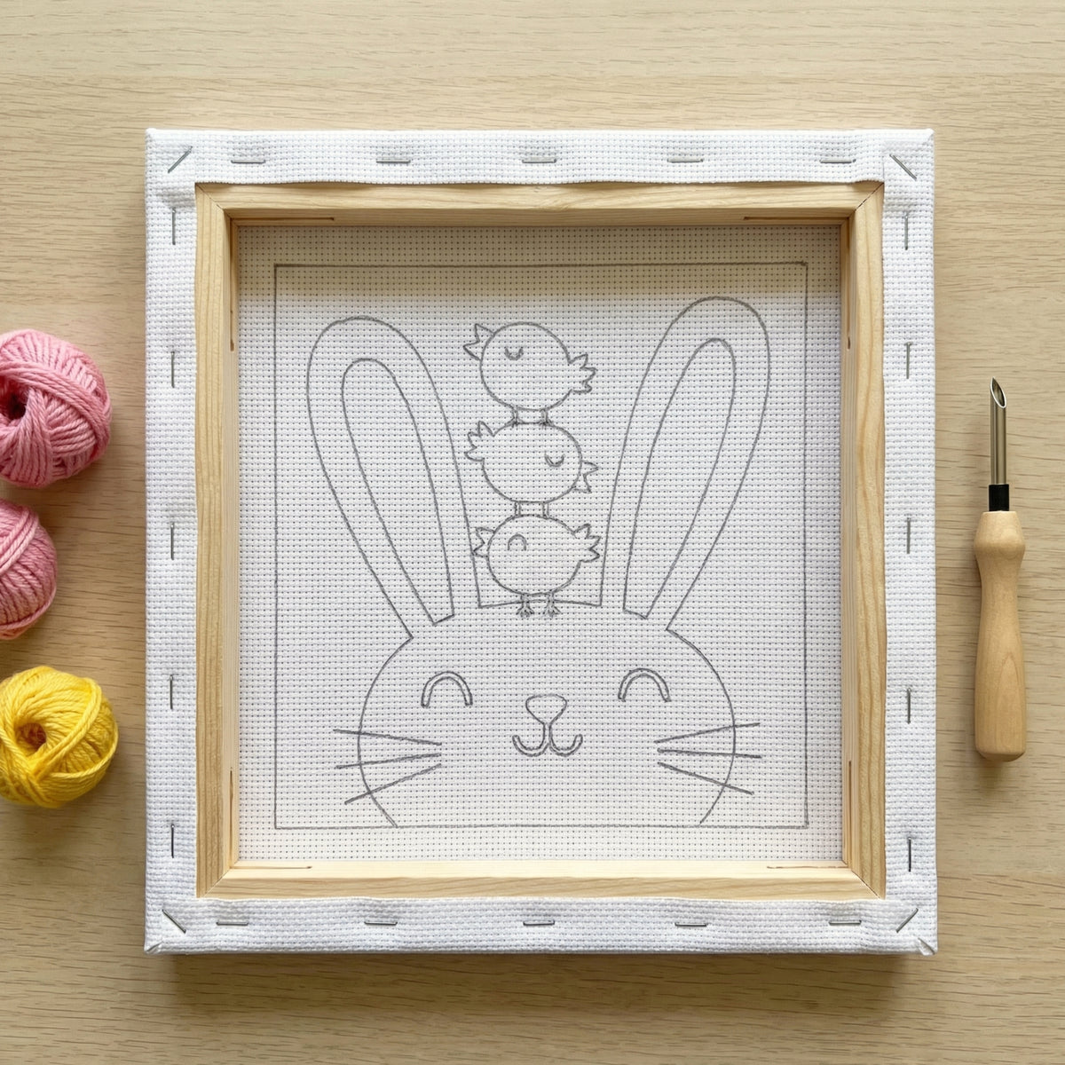 Punch needle kit contents - Pre-stretched canvas, yarn, needle and step-by-step instructions.