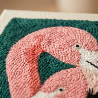 Finished Duo de Flamants Roses punch needle artwork styled in a home interior.