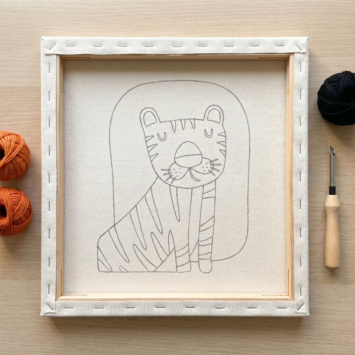 Punch needle kit contents - Pre-stretched canvas, yarn, needle and step-by-step instructions.