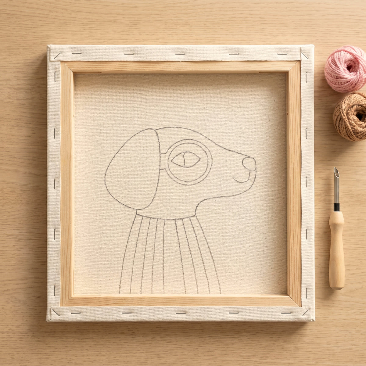 Blank pre-stretched canvas with the Rafael le Chien Éclaireur pattern pre-printed, ready for punch needle embroidery.
