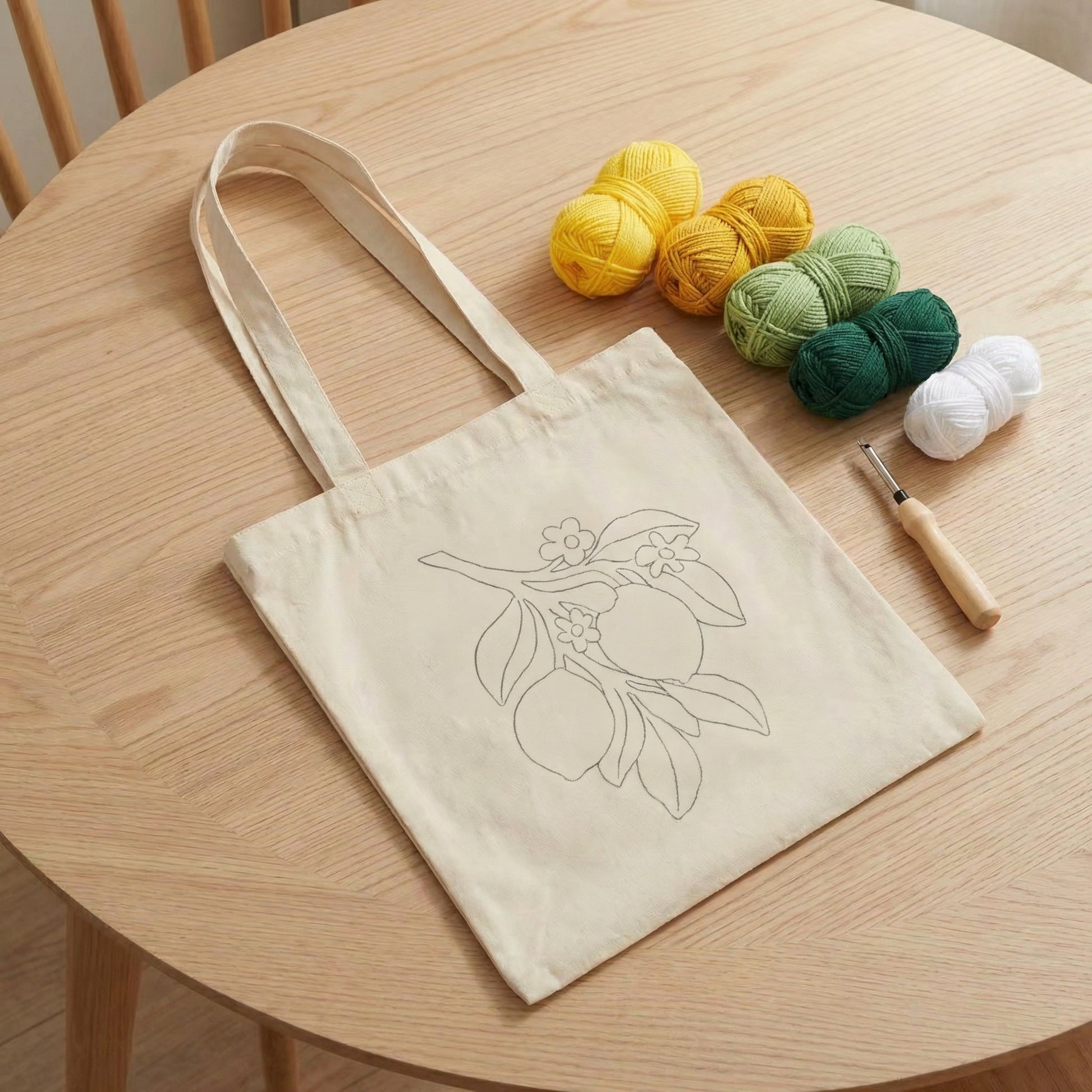 Complete Tonia Art DIY set for tote bag - Pre-printed lemon pattern, yarn palette, hoop, and needle.