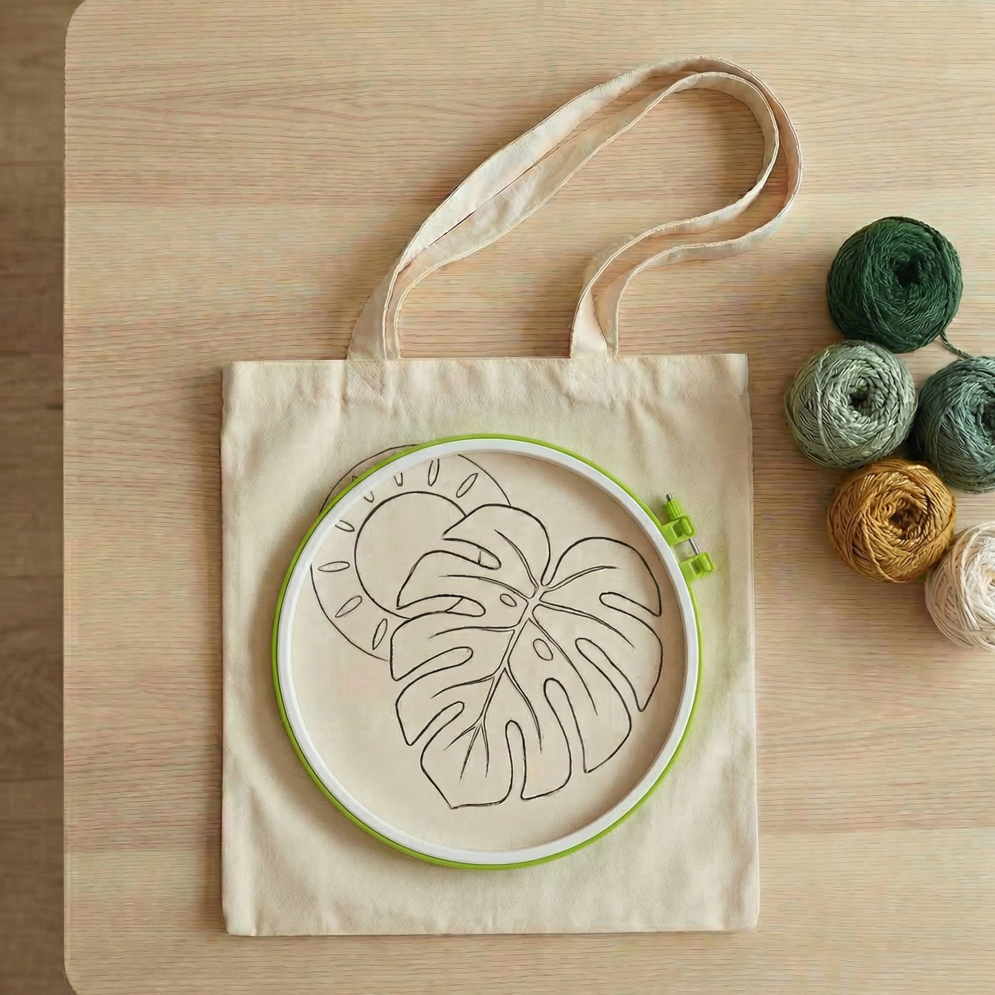 Complete Tonia Art DIY set for tropical tote bag - Pre-printed design, green yarn palette, hoop, and needle.
