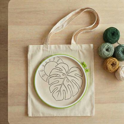 Complete Tonia Art DIY set for tropical tote bag - Pre-printed design, green yarn palette, hoop, and needle.