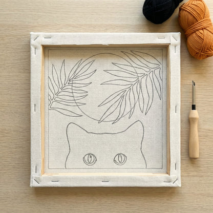 Punch needle kit contents - Pre-stretched canvas, yarn, needle and step-by-step instructions.