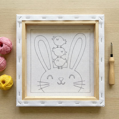 Punch needle kit contents - Pre-stretched canvas, yarn, needle and step-by-step instructions.