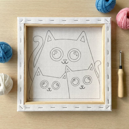 Finished Catflix punch needle artwork styled in a home interior.