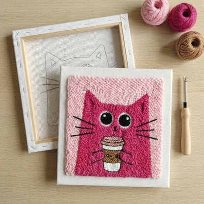 Finished Chat & Cappuccino punch needle artwork styled in a home interior.