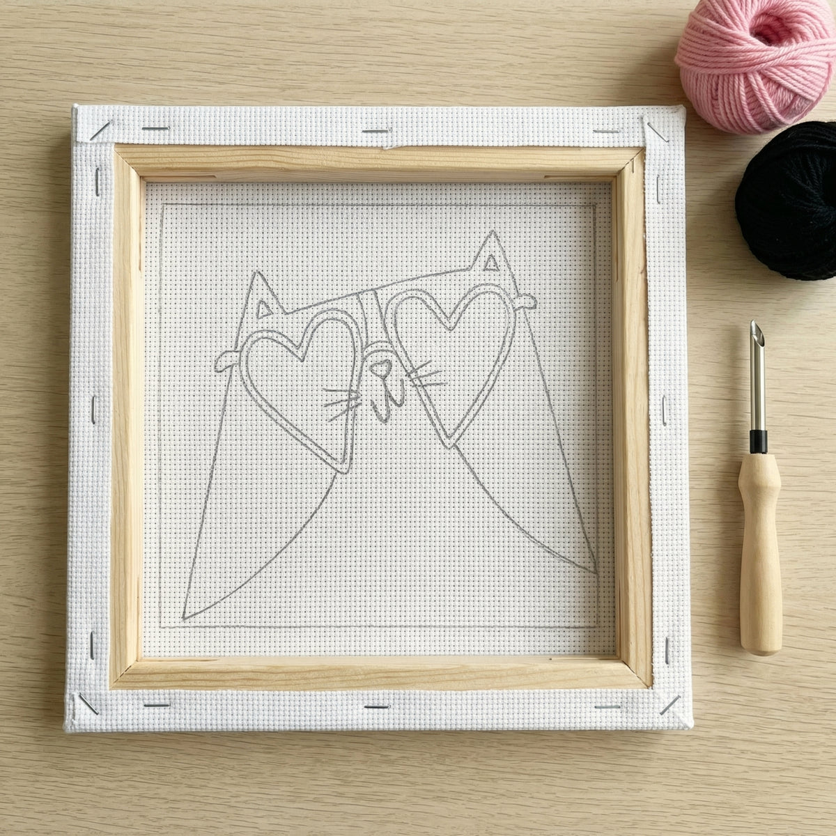 Punch needle kit contents - Pre-stretched canvas, yarn, needle and step-by-step instructions.