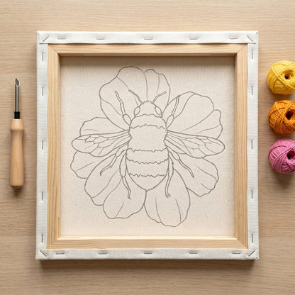 Finished Abeille sur sa Fleur punch needle artwork styled in a home interior.