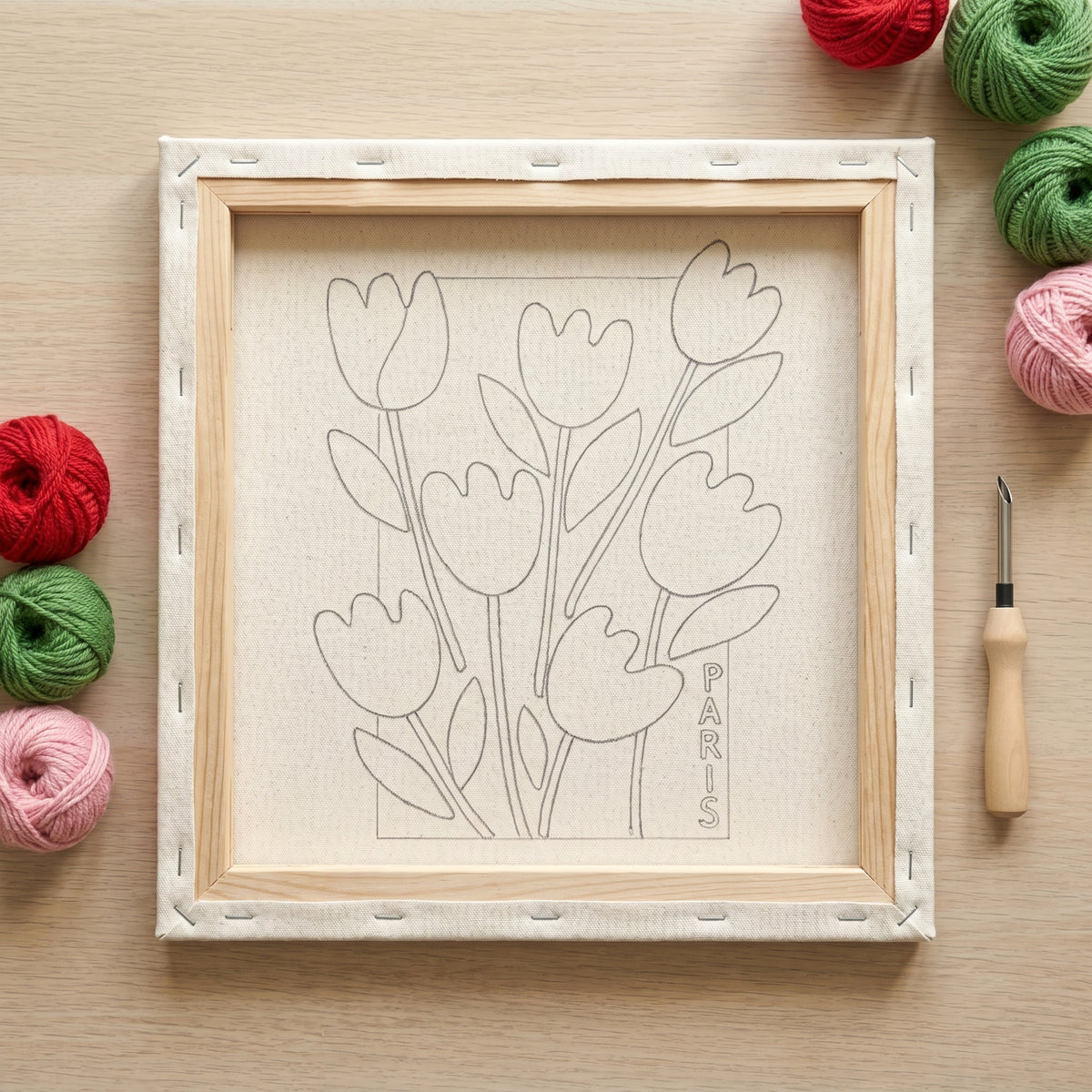 Finished Bouquet de Printemps punch needle artwork styled in a home interior.