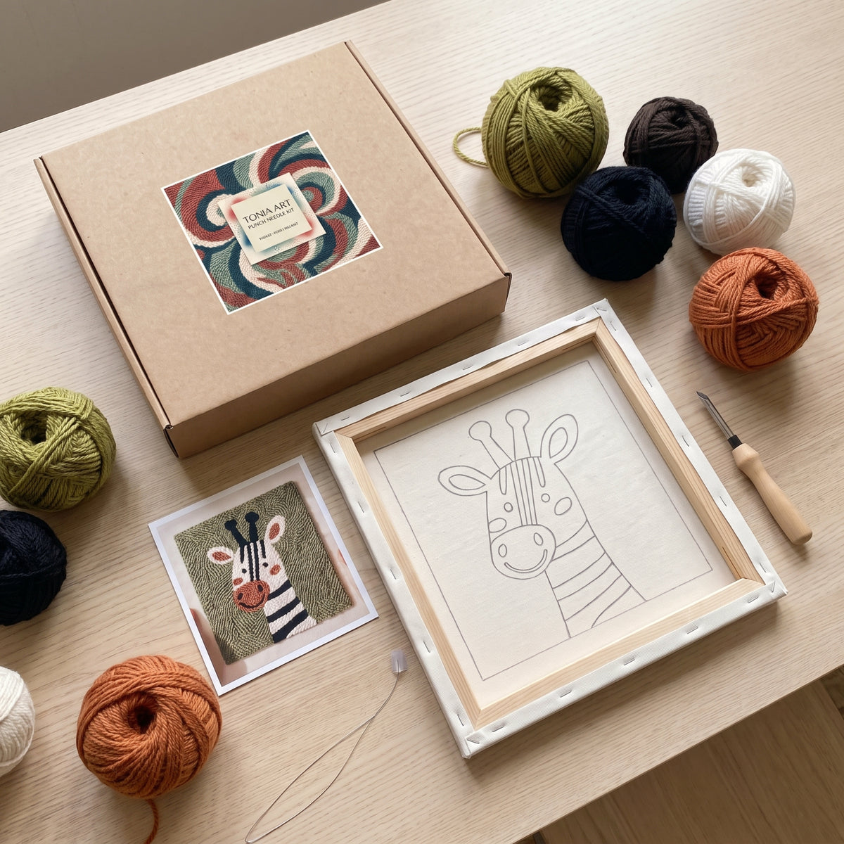 Punch needle kit contents - Pre-stretched canvas, yarn, needle and step-by-step instructions.