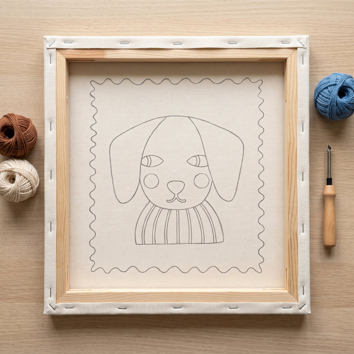 Blank pre-stretched canvas with the Charlie le Chiot pattern pre-printed, ready for punch needle embroidery.